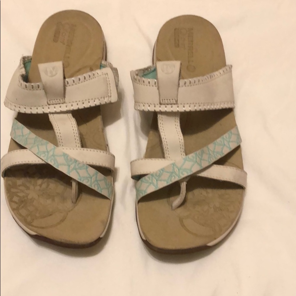 Merrell ivory and aqua sandals .